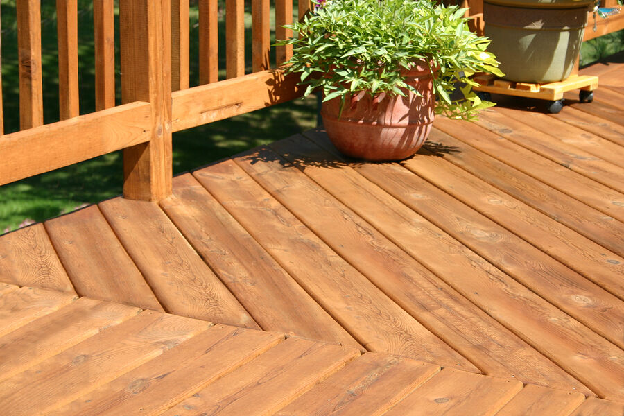 Deckmasters Inc. stains decks and fences