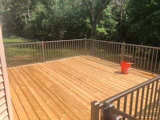 Deckmasters Inc. stains decks in Saint Michael and fences